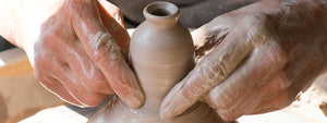 handmade pottery in process on the wheel